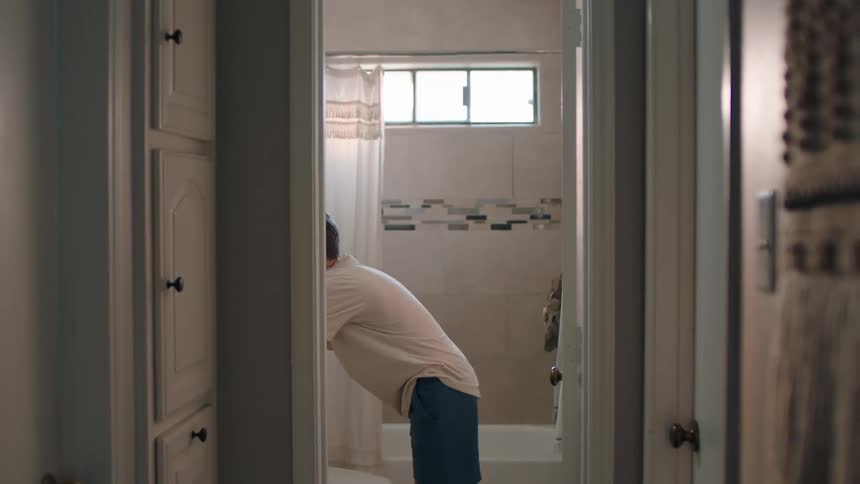 A boy wipes his hands on a towel