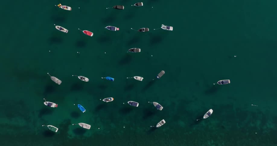 Many small boats anchored in a harbor