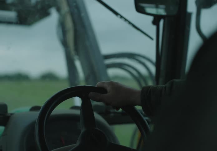 Someone drives a tractor