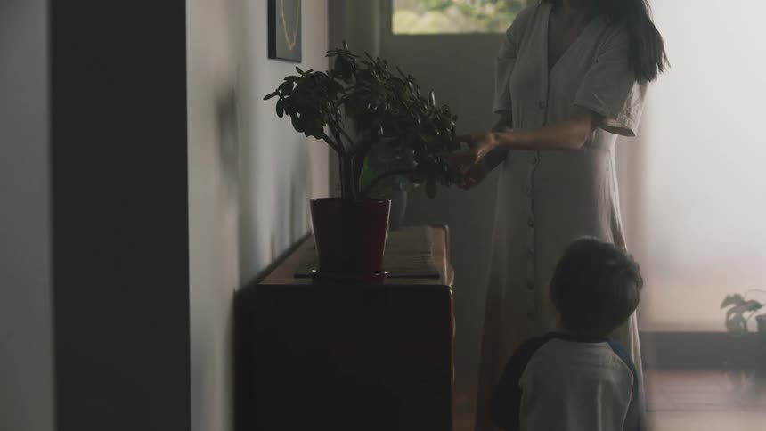 A family are indoors inside of there house in the day time