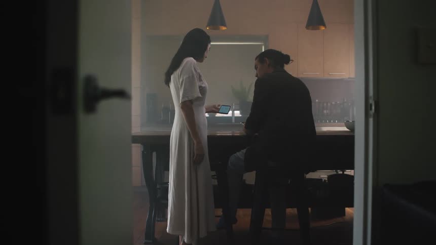 Young couple is inside of there home in the day time