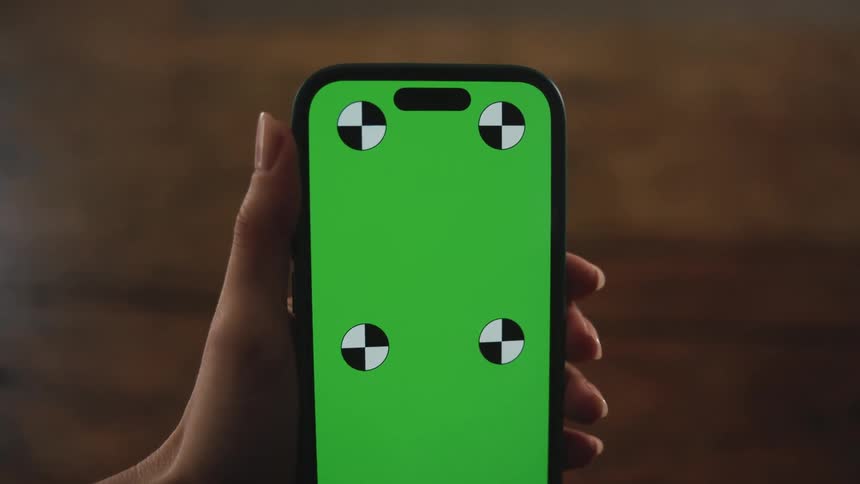 Woman holds mobile phone