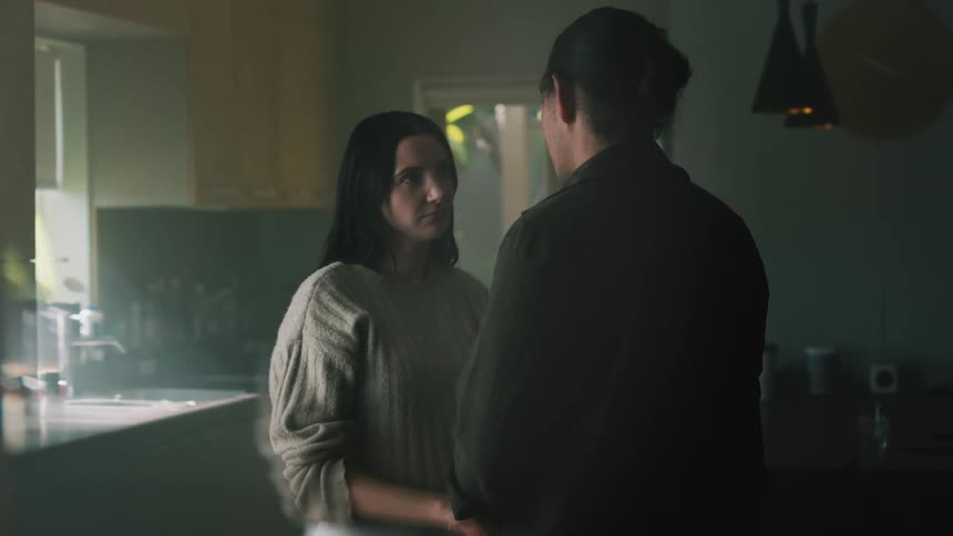 A man is talking with a woman