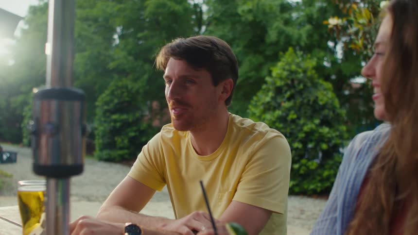 Man and woman sitting at a table talking
