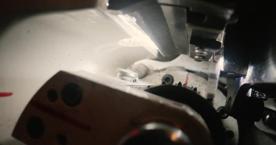 The inside of a machine working with parts turning