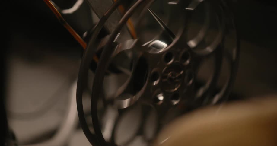 Hand operating a vintage film crank
