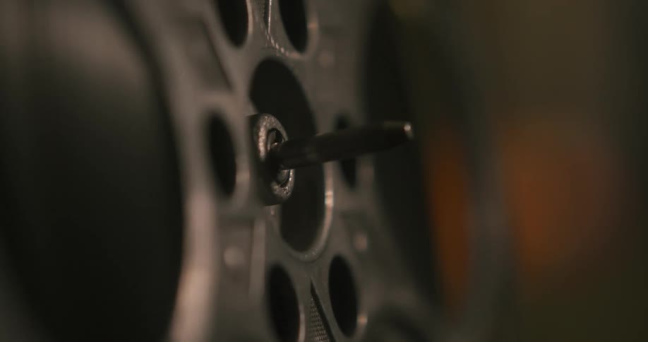 Reel turns on the shaft of a film projector