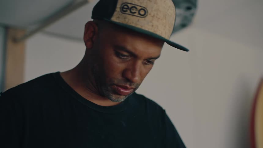 Portrait of a man with a cap in a concentrated indoor space