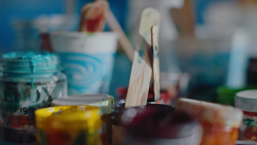 Small pots of paint on a table