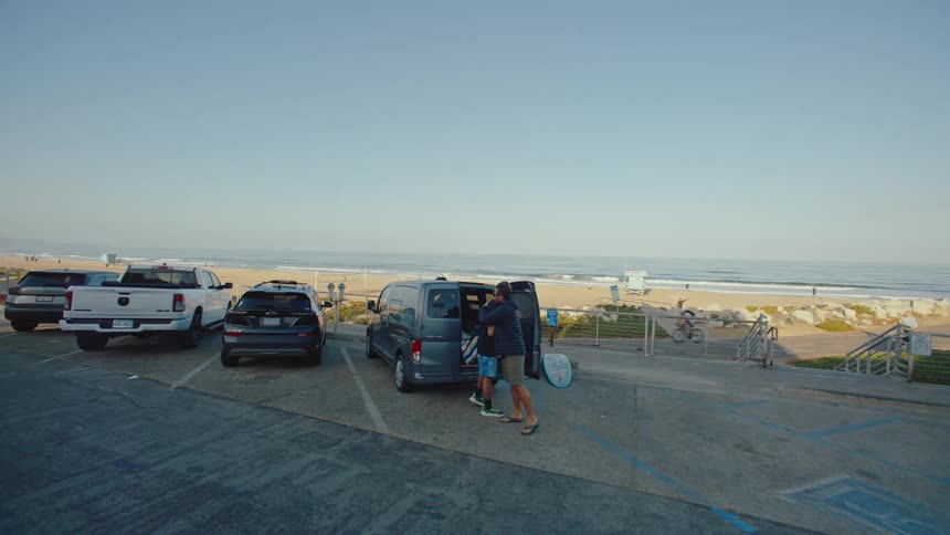 Men greet each other on the boardwalk
