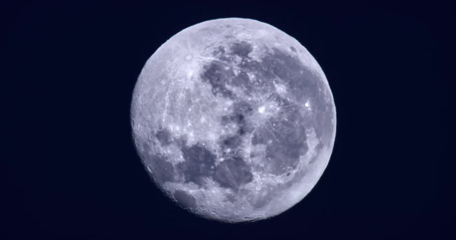 Close up of a moon against a blue sky