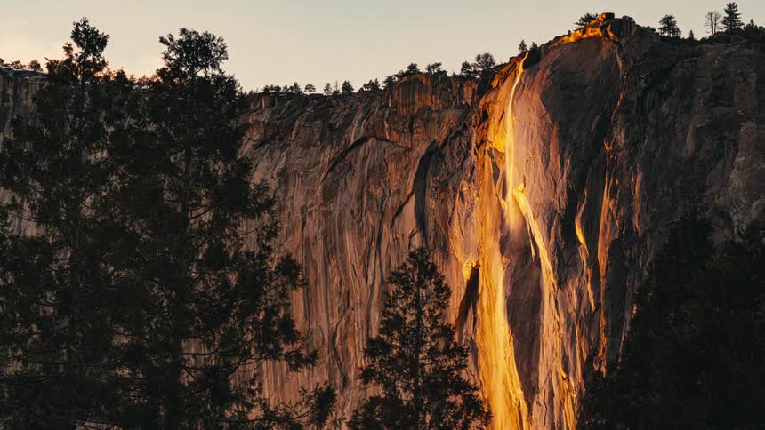 Light reflecting off a waterfall and disappearing as the day dawns