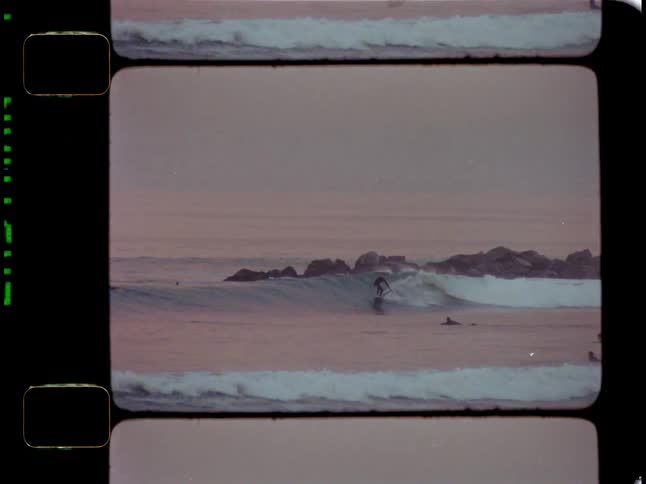Group of people at sea surfing waves
