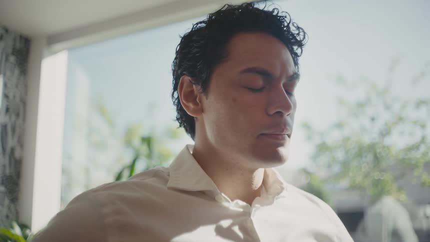 Portrait of a man with a discouraged facial expression in an indoor setting