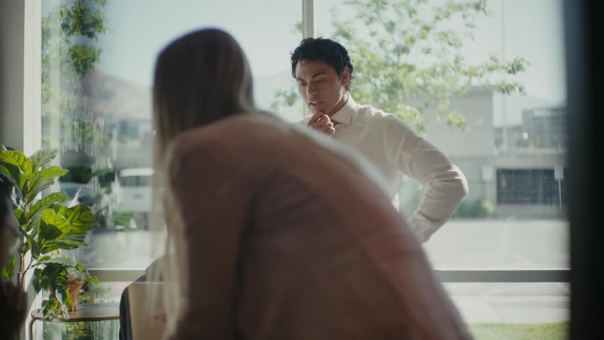 Man and woman standing in an office environment