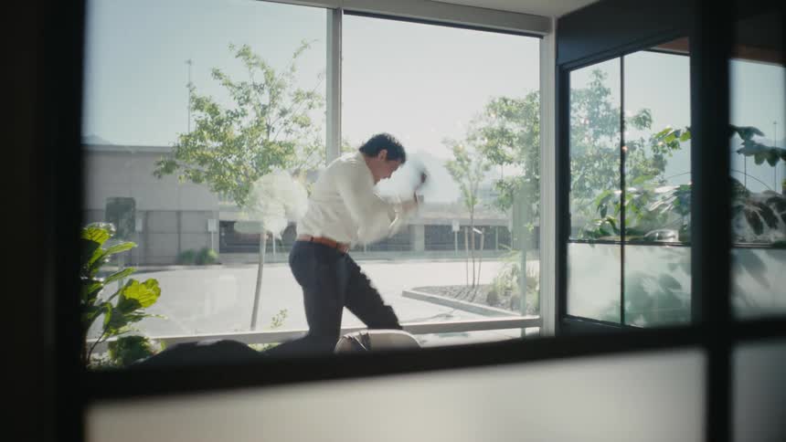 Man jumps in excitement during a phone call