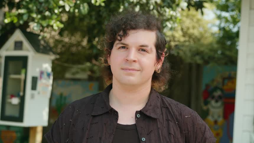 Portrait of a man in an outdoor setting with trees around