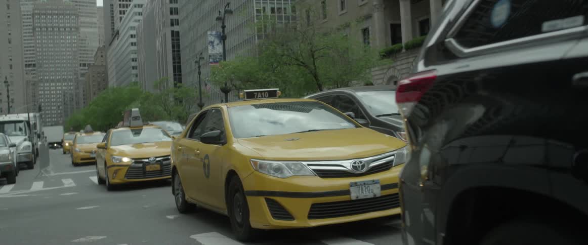 Cars are stuck in traffic on a city street