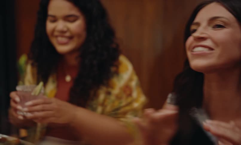 Friends in an indoor environment talking and laughing