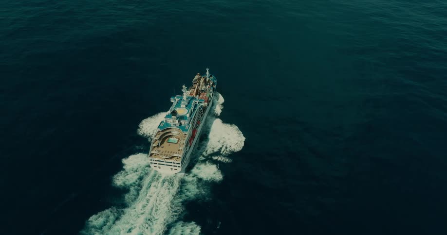 A cruise ship travels in the water