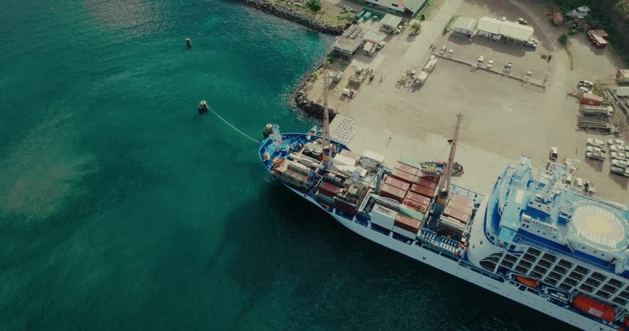 A cargo ship is docked at port