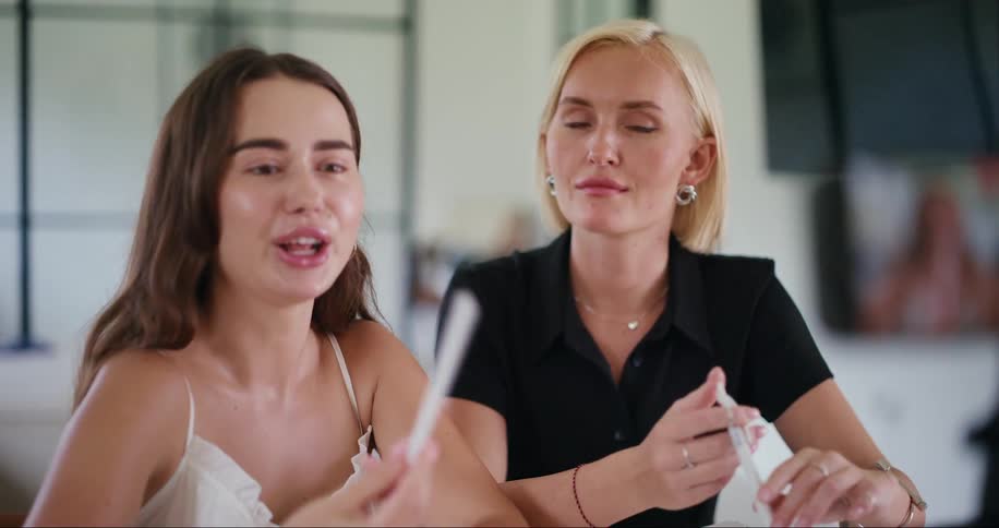 Smartphone filming two women talking
