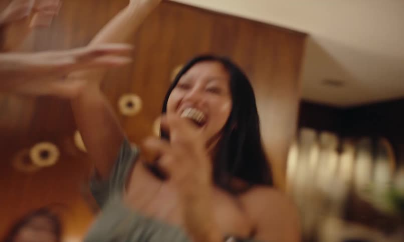 Two women dancing and having fun in the living room