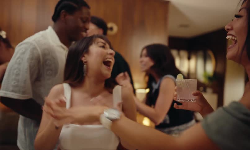 Party time with friends dancing and drinking in the living room