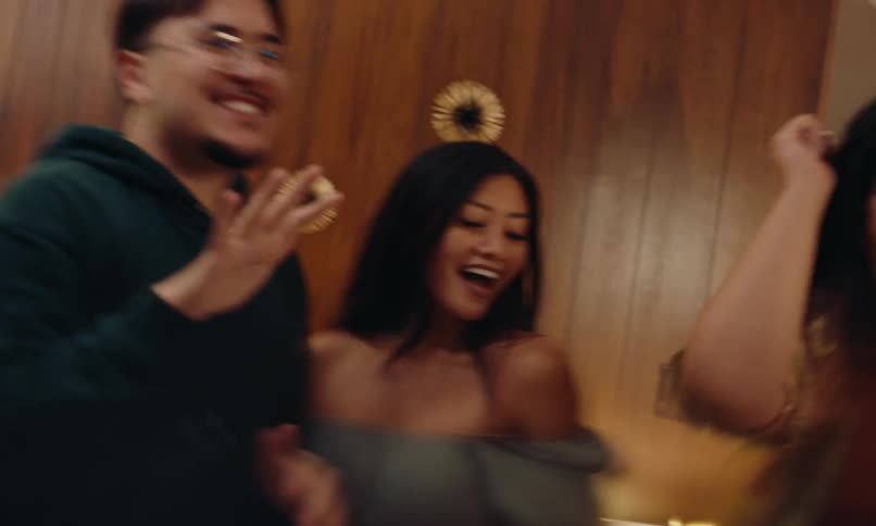 Group of friends dancing at a party indoors