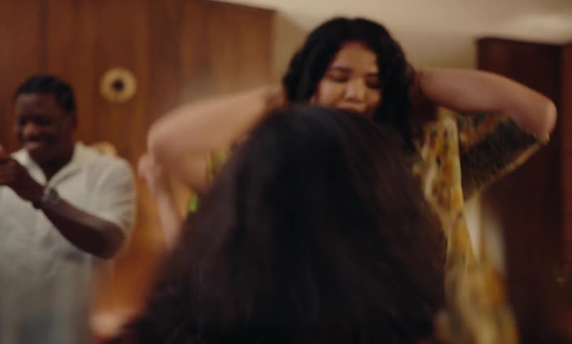 Friends having fun dancing in the living room at a celebration