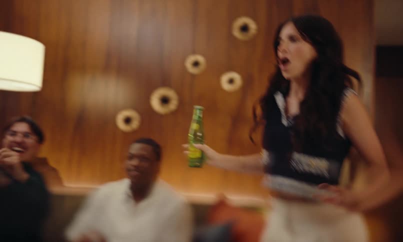 Group of friends dancing in living room at home and having fun at a party celebration
