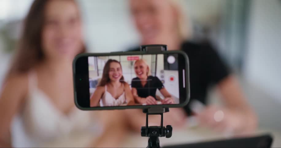Iphone recording two women talking in front of the cell phone
