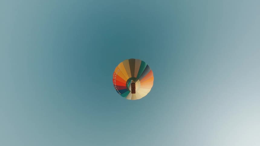 Point of view footage falling off a hot air balloon floating on a blue sky