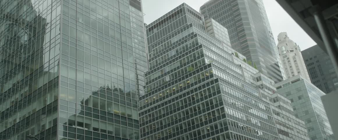 High rise buildings are being filmed from the ground level