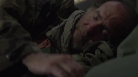 Homeless man laying down to sleep outside