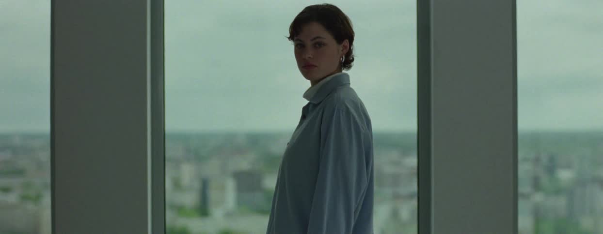 Woman inside a room in a mirrored building