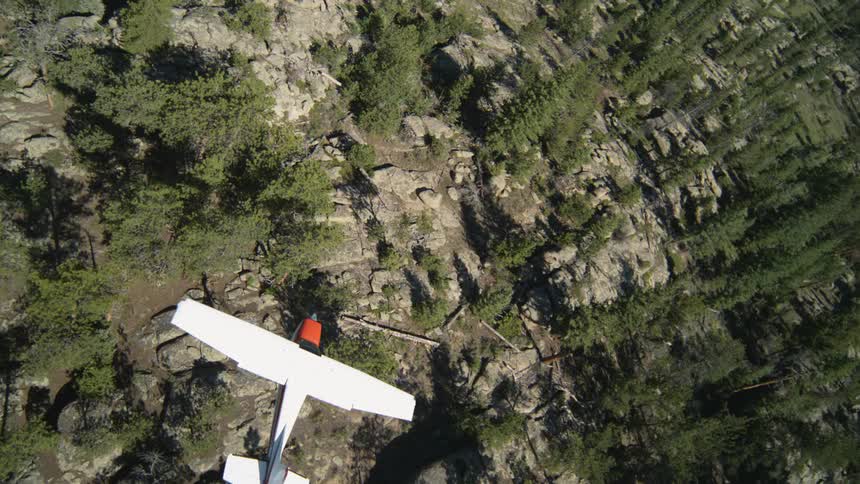 Aerial panorama of a single engine flight flying over mountains