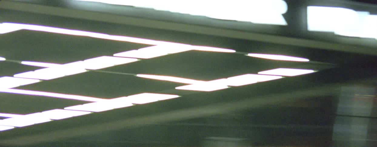 Lights from a ceiling in an abstract flickering establishment