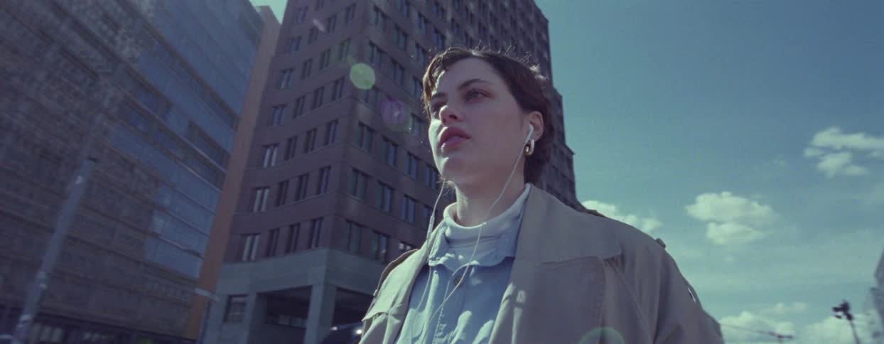 A woman is standing in the city