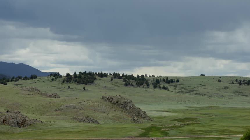 The hills are covered with green and trees