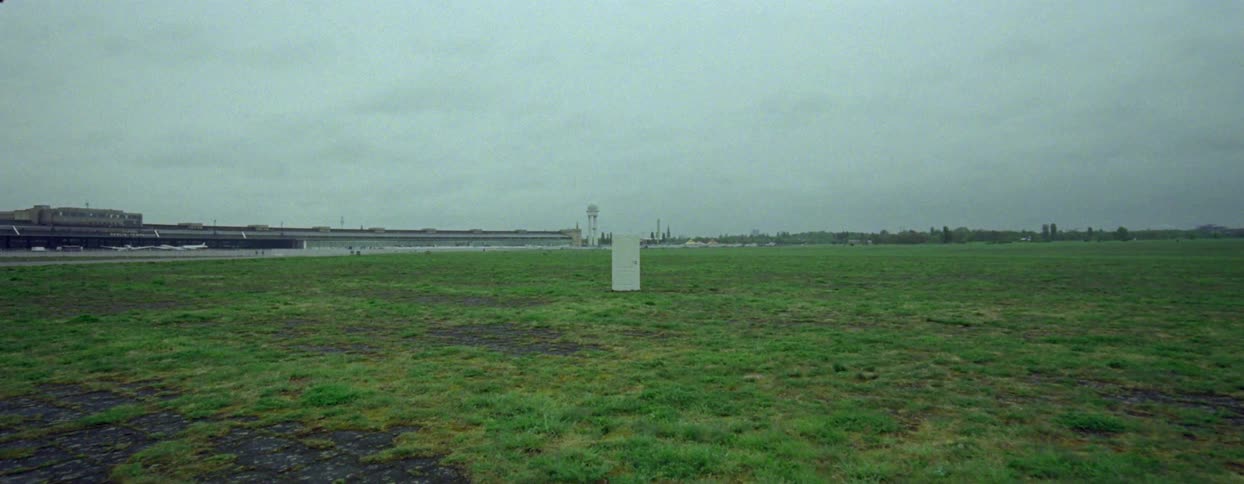 White abstract panel in a field