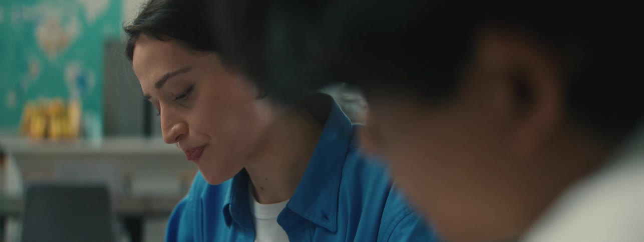 A teacher is helping a student in the classroom