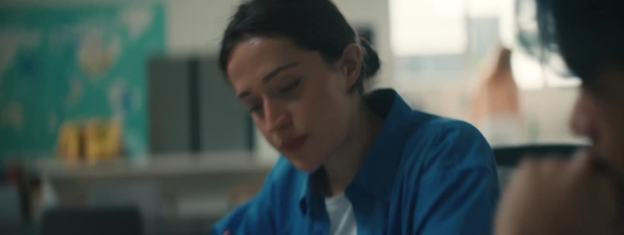 Man and woman sitting at a table concentrating