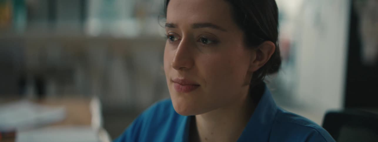 Woman smiles while working in the office