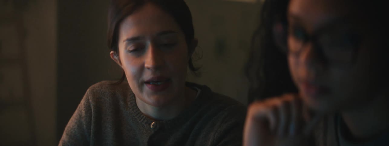 Two women talking about something theyre working on