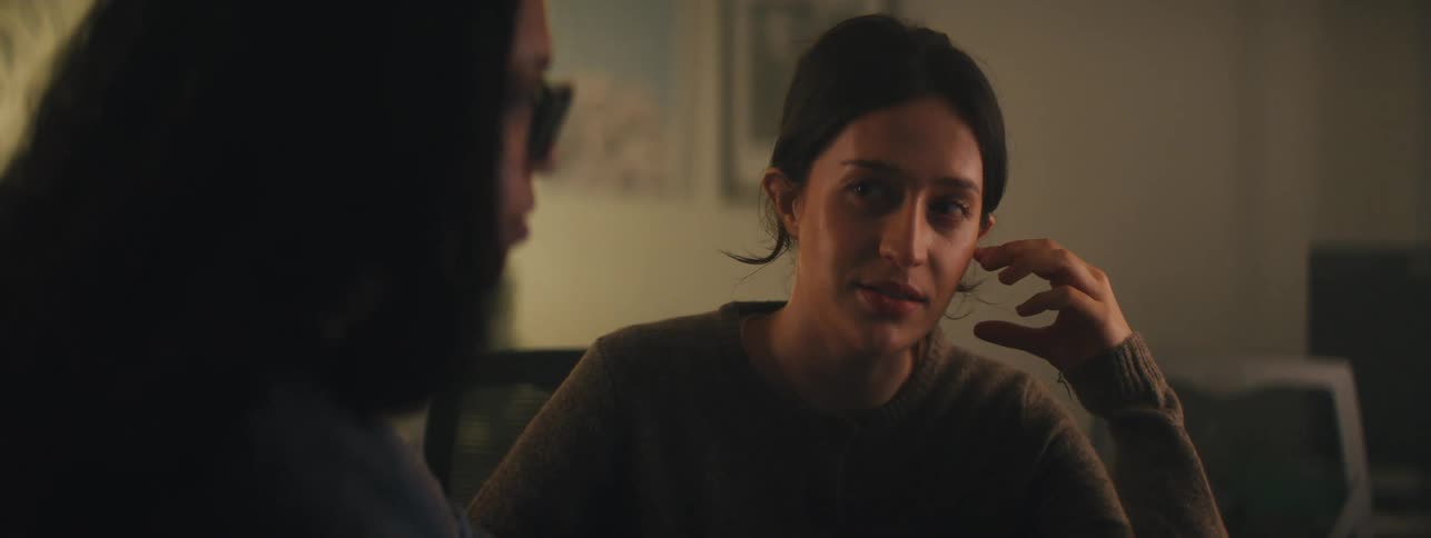 Two women sitting in a room talking