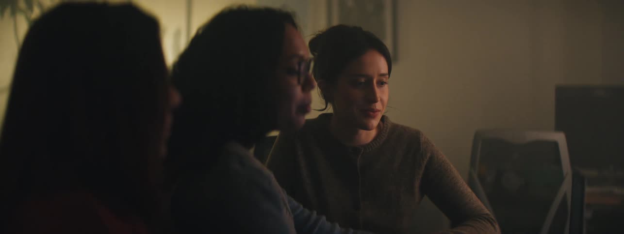 Three women sitting and talking to each other