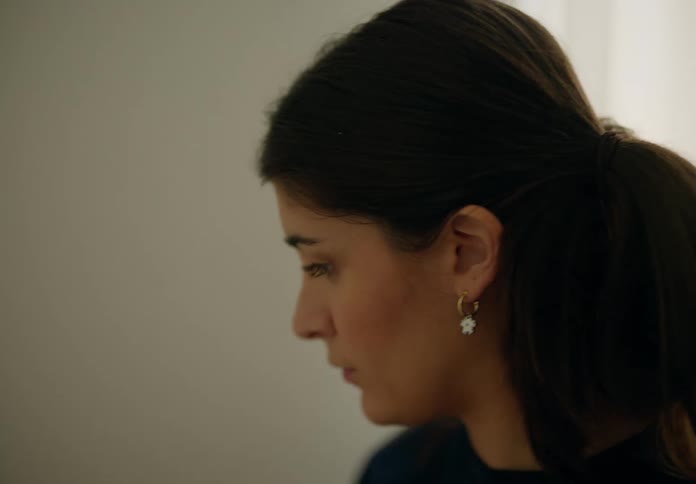 Portrait of a young woman concentrating indoors