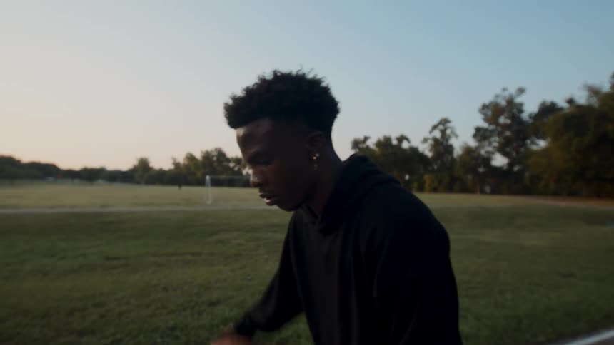 Man hitting basketball on court