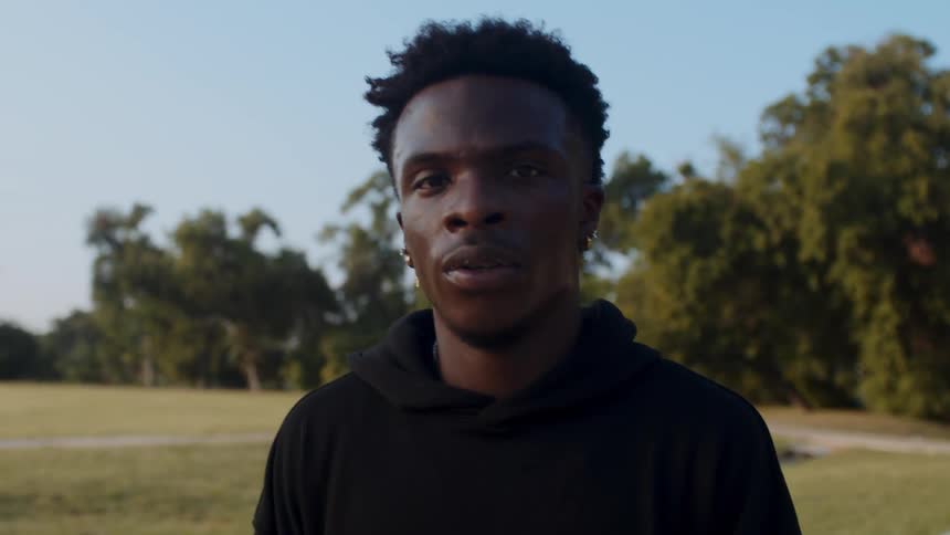 Portrait of a man on a court with trees in the background